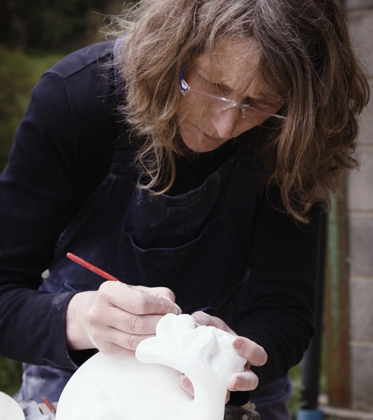 Staff member working on an object