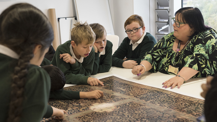 Burrell Staff member speaking with group of school children